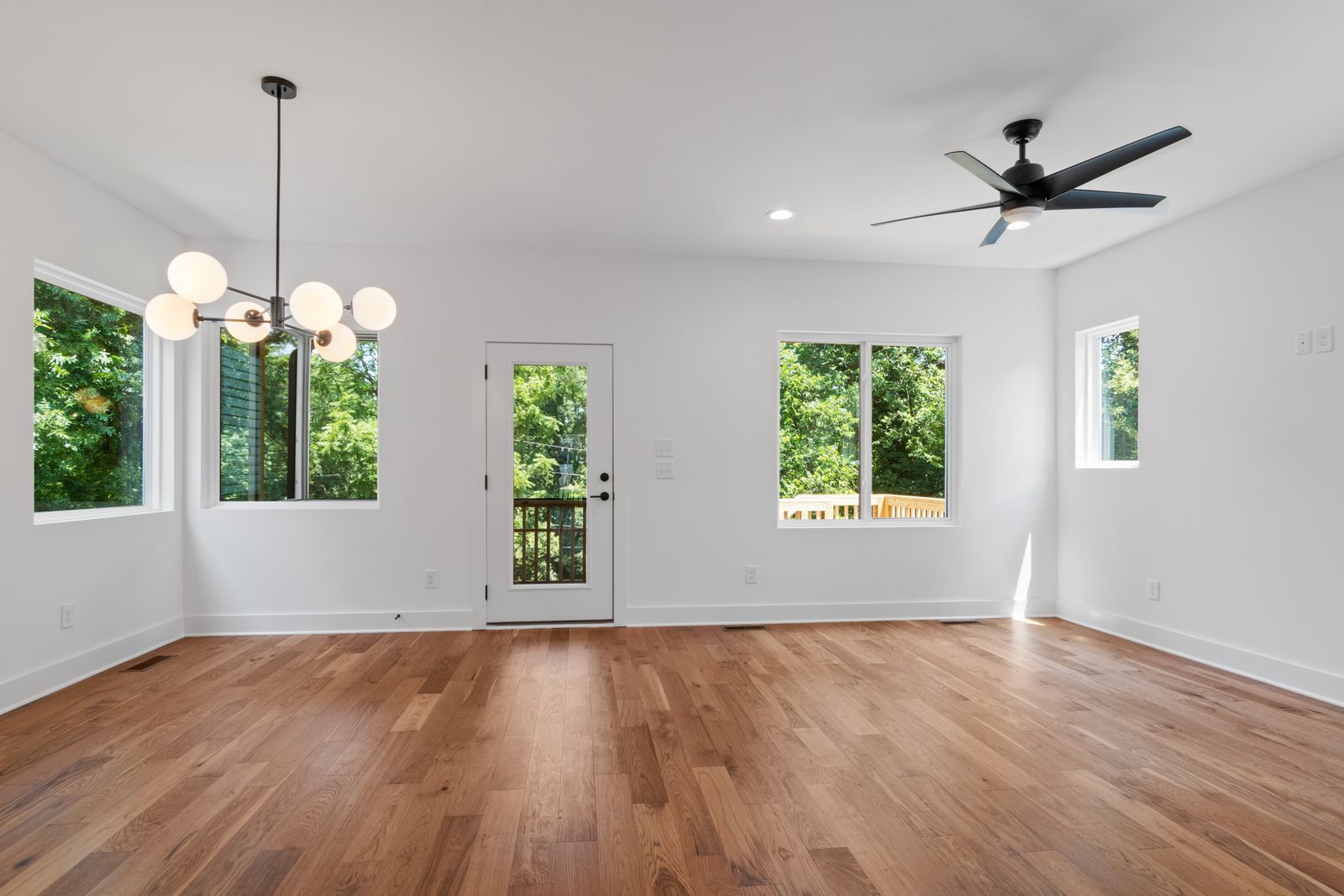 An empty, swept room with wood floors after a clear-out