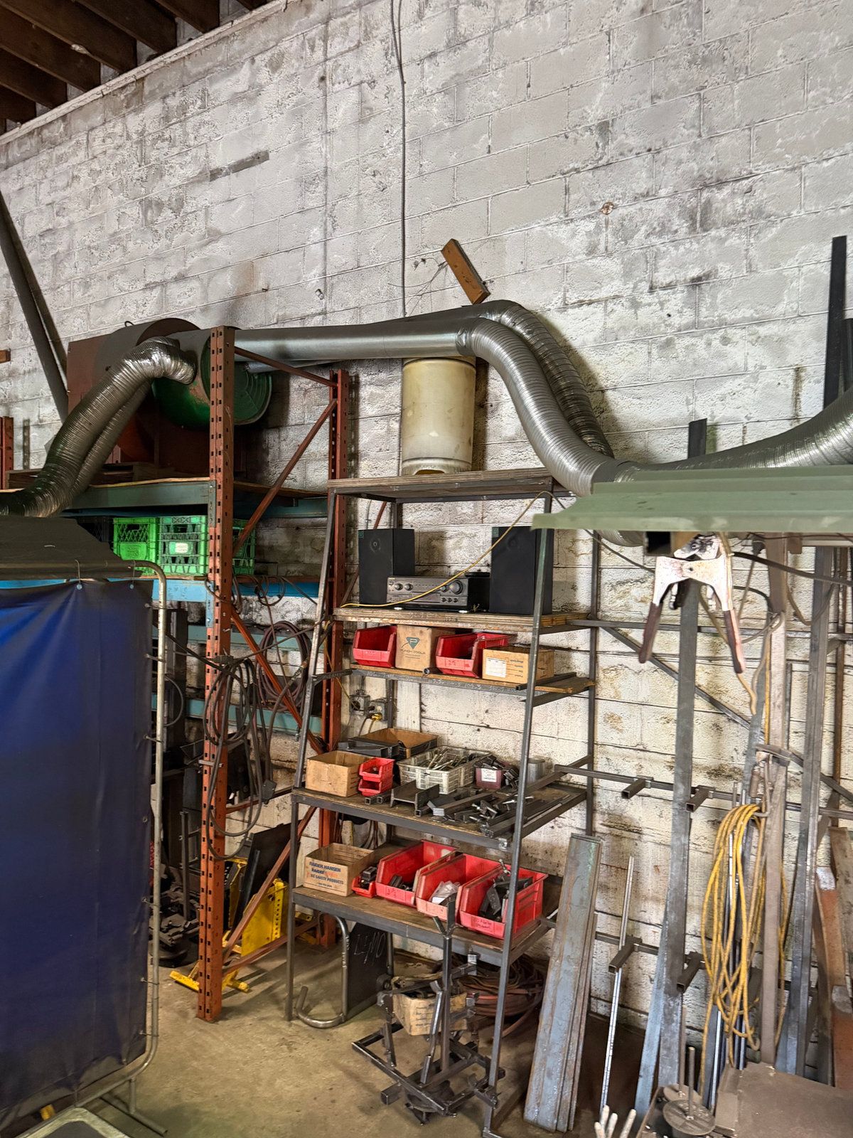 Inside a workshop we liquidated: shelving, parts and steel stock