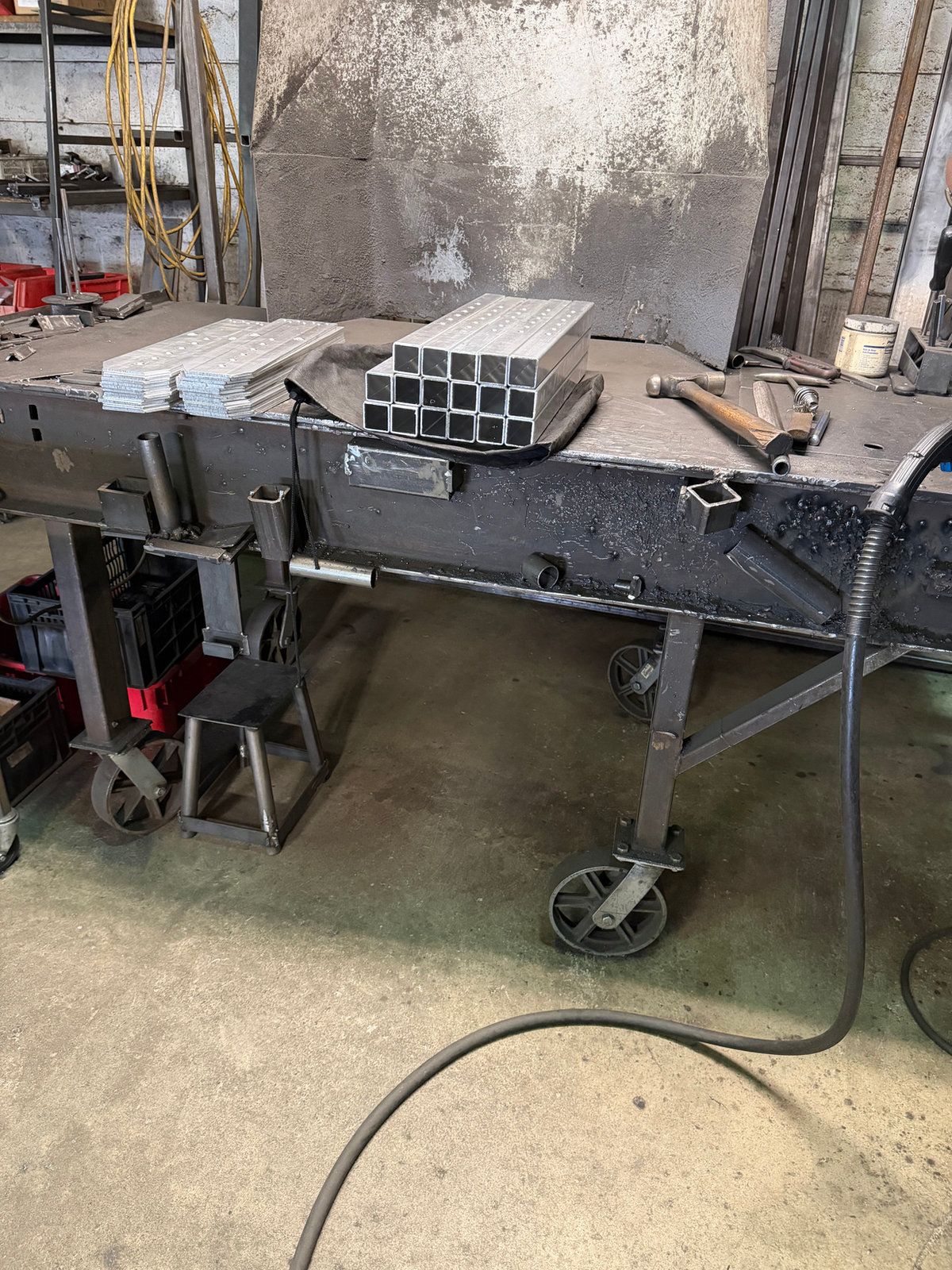 Welding table and steel stock in a workshop